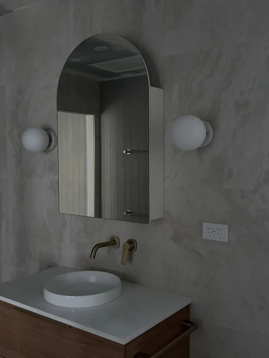 Custom feature lighting in a premium bathroom fit-out